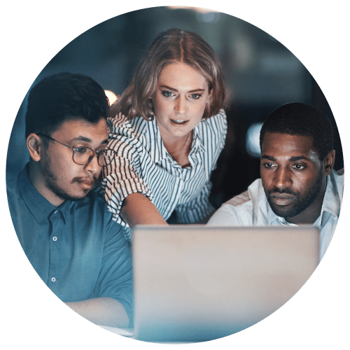 two men and a woman looking at a laptop