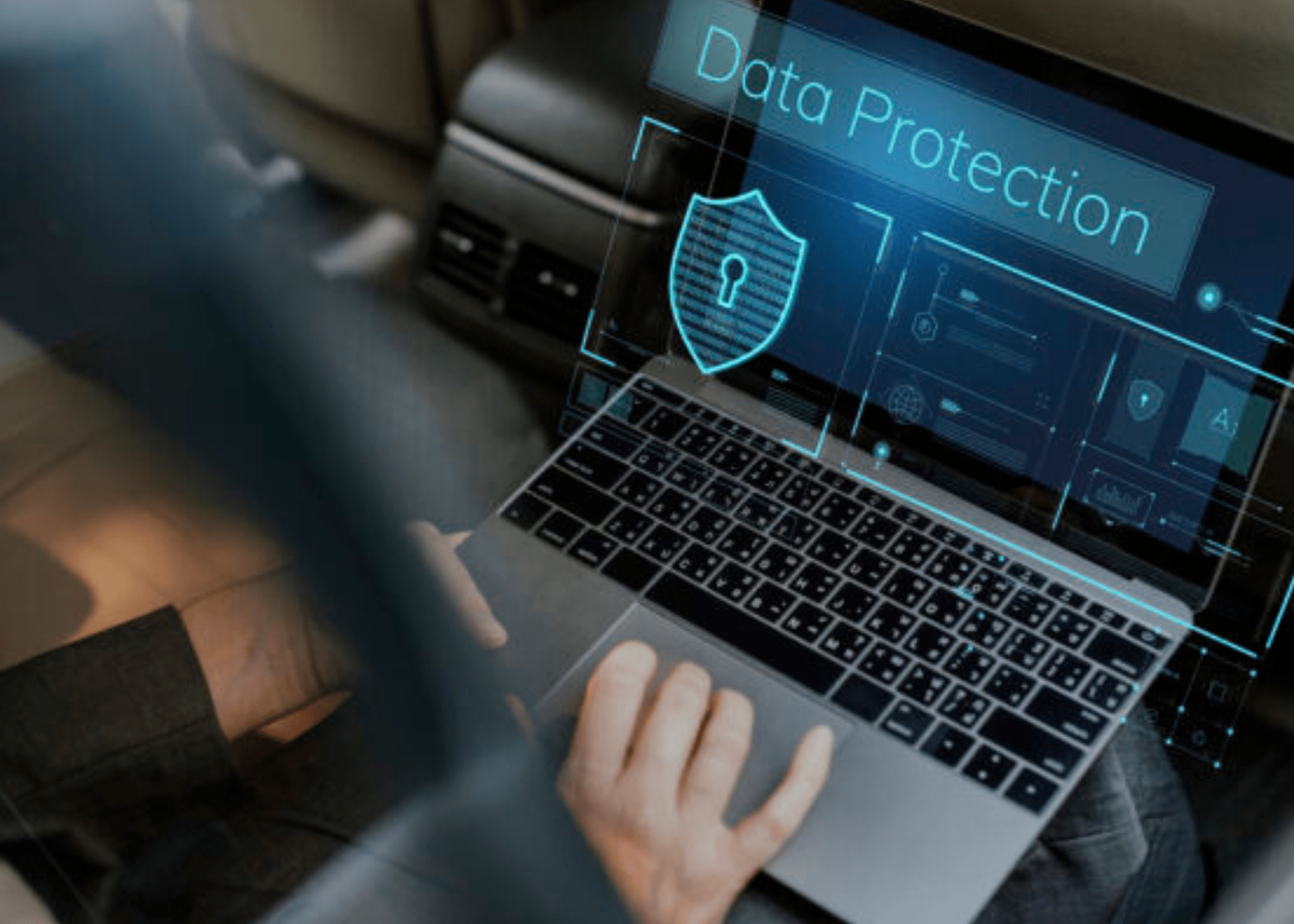 Computer with hands typing with the words "data protection"