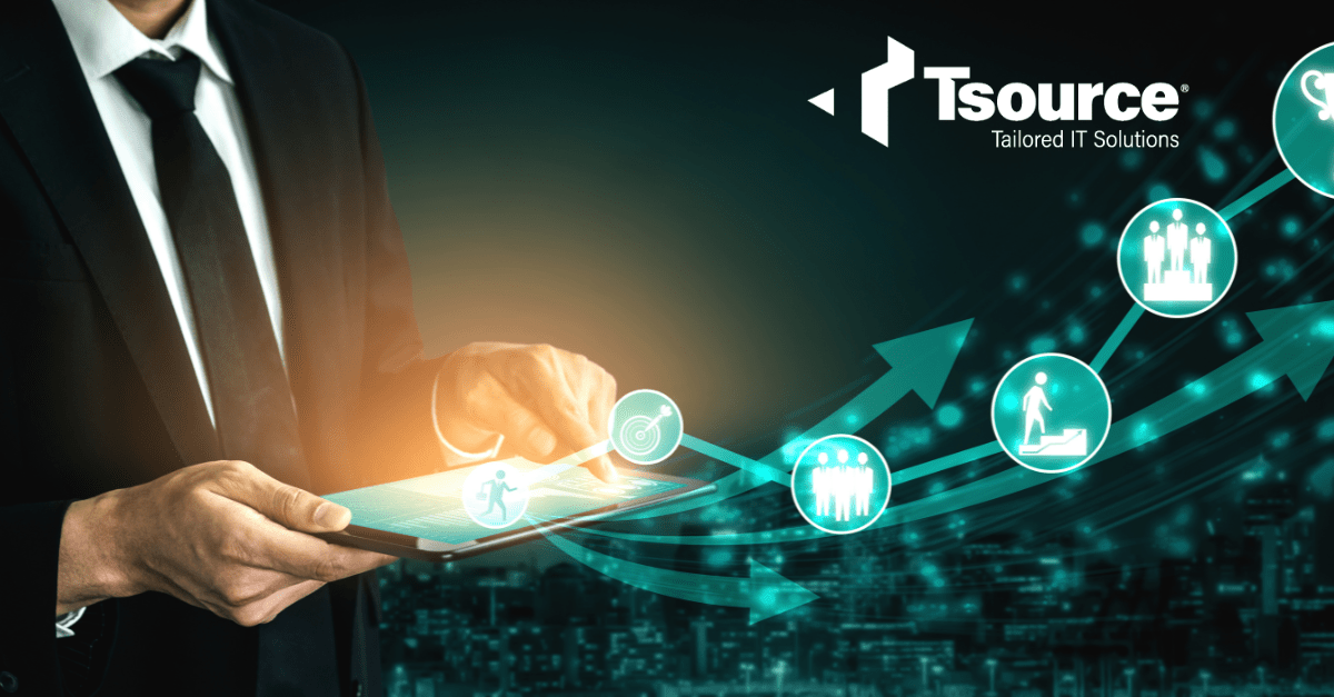 image with a person in a black suit and tie holding a tablet with some icons regarding IT services